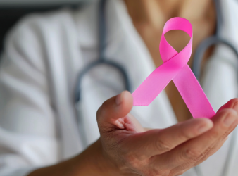 Image of doctor showing pink ribbon(breast cancer awareness).