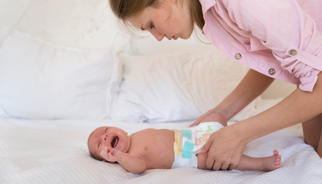 Mother holding a newborn baby, highlighting the study on low birth weight and cognitive decline in women