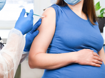 Pregnant woman receiving COVID-19 vaccine